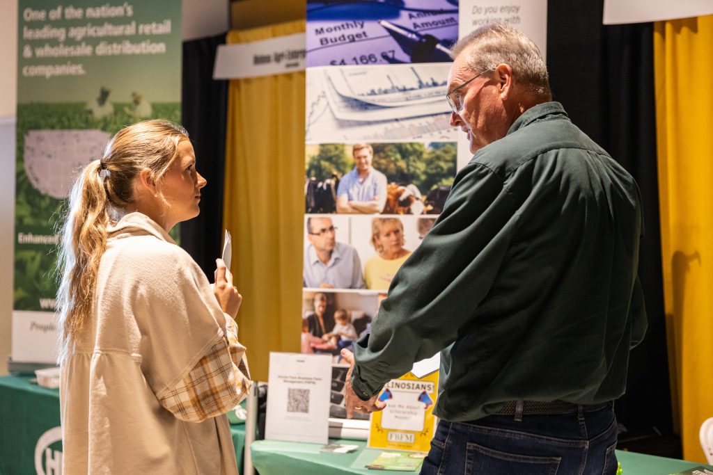 Student talking to employer at the Career Fair.